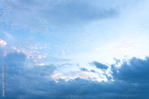 Beautiful cloudscape with fluffy white clouds drifting across a bright blue sky