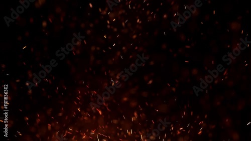 Flying around fire dust particles sparks or ember from a burning fire with realistic movement. on a black background
