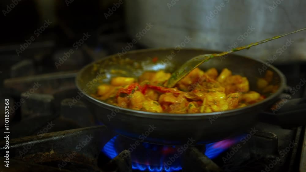 Cooking and mixing ingredients in a frying pan in a professional kitchen slow motion Cooking and mixing ingredients in a frying pan in a professional kitchen slow motion