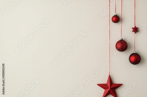 Decorative red Christmas ornaments hanging on a light background for festive ...