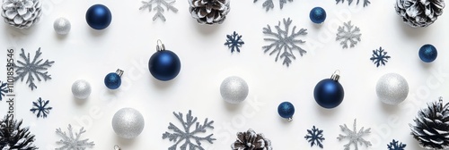 Festive decorations featuring blue and silver ornaments with snowflakes and p...
