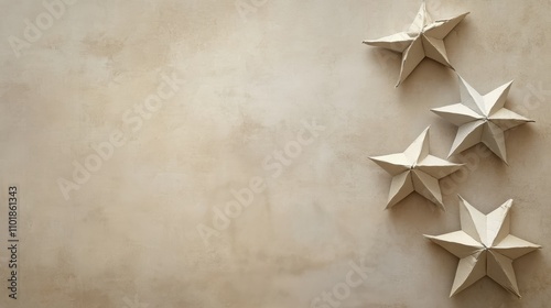 Decorative paper stars arranged on a neutral background for festive decoratio...