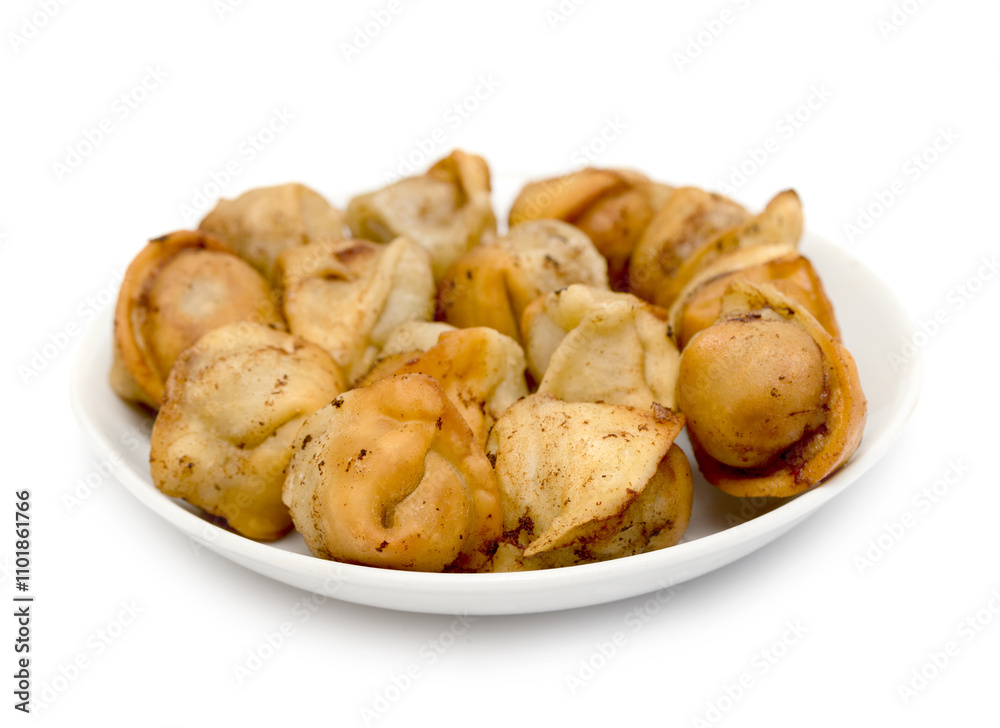fried dumplings in a plate on a white background fried dumplings in a plate on a white background