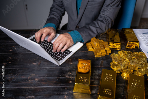 Gold bar stock photo, picture and photo on black table at night.