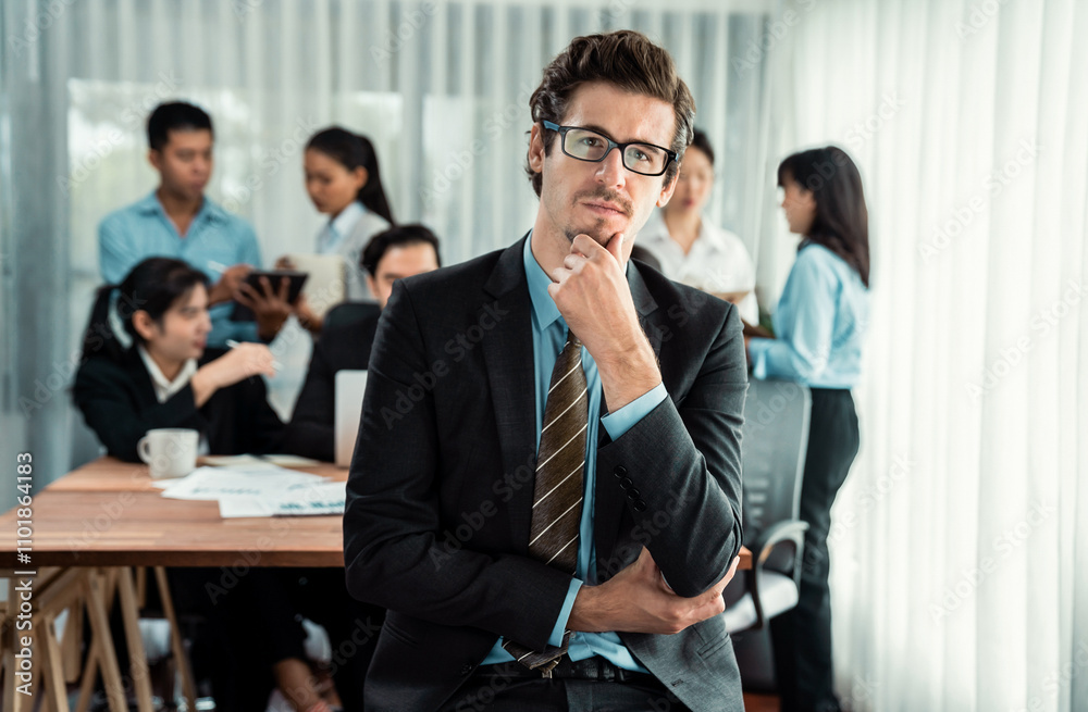 Portrait of happy businessman looking at camera with motion blur background of business people movement in dynamic business meeting. Habiliment Portrait of happy businessman looking at camera with motion blur background of business people movement in dynamic business meeting. Habiliment