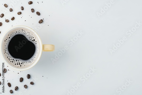 Warm cup of coffee beside scattered coffee beans on a simple white background