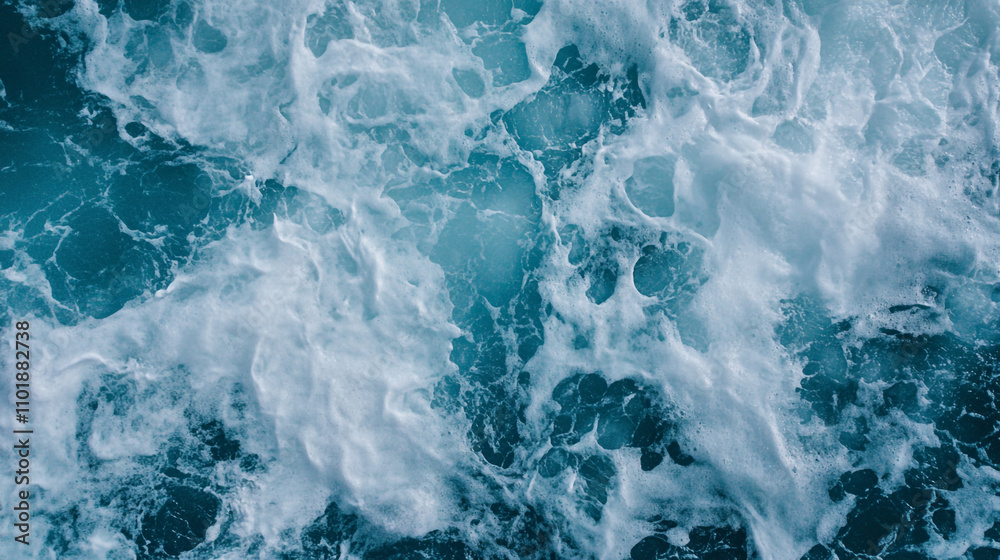 Waves crashing against rocks in a vibrant ocean during daylight hours Waves crashing against rocks in a vibrant ocean during daylight hours