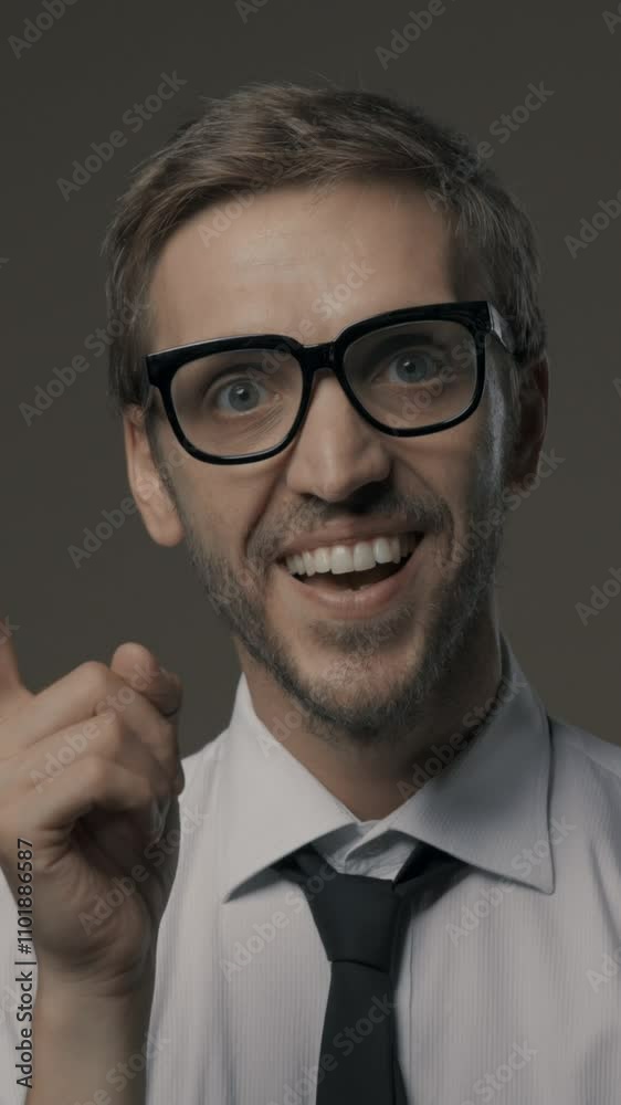 Smart businessman having a great idea and finding a solution for his business, he is smiling and pointing upwards Smart businessman having a great idea and finding a solution for his business, he is smiling and pointing upwards