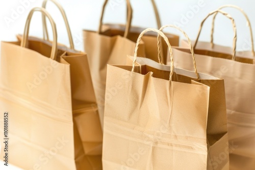 A collection of brown paper bags sitting on a table, perfect for use in scenes requiring packaging or everyday items photo