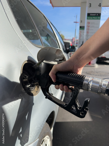 A person is filling up a car with gas