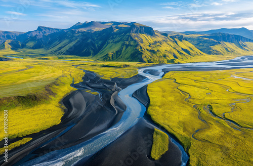 Aerial view of Iceland's glacial rivers and mountains, with intricate patterns of braided waterways photo