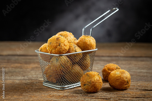 Codfish dumplings. fried dumpling, cod dumpling, fish meat, bacalao bunuelos.