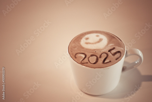 hot coffee with foam milk art 2025 on wooden table 
