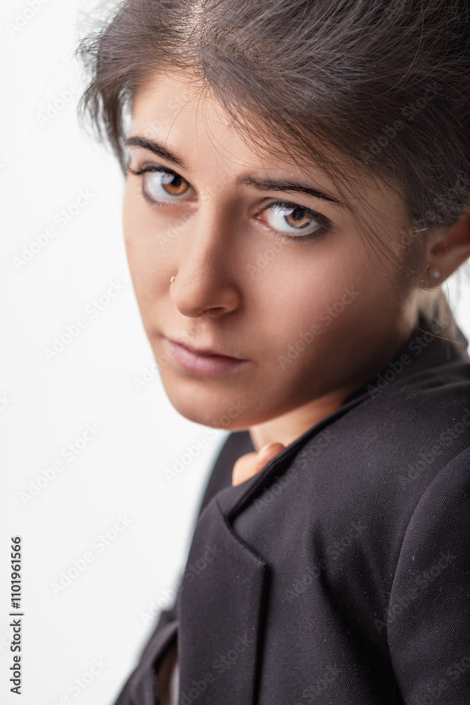 Young businesswoman looking serious and pensive with hand on jac Young businesswoman looking serious and pensive with hand on jac