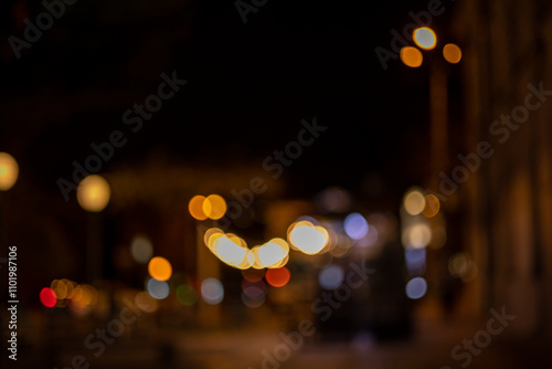 Wallpaper Mural Night background with lights of passing cars, garlands and illuminated shop windows Torontodigital.ca