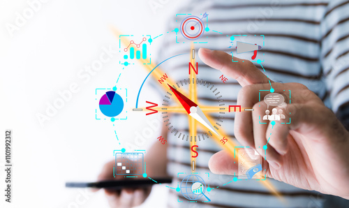 Compass for navigation, direction of business strategy to achieve the highest goal, of personnel control, scheduling and public relations, A man holds a virtual compass that to guide to success.