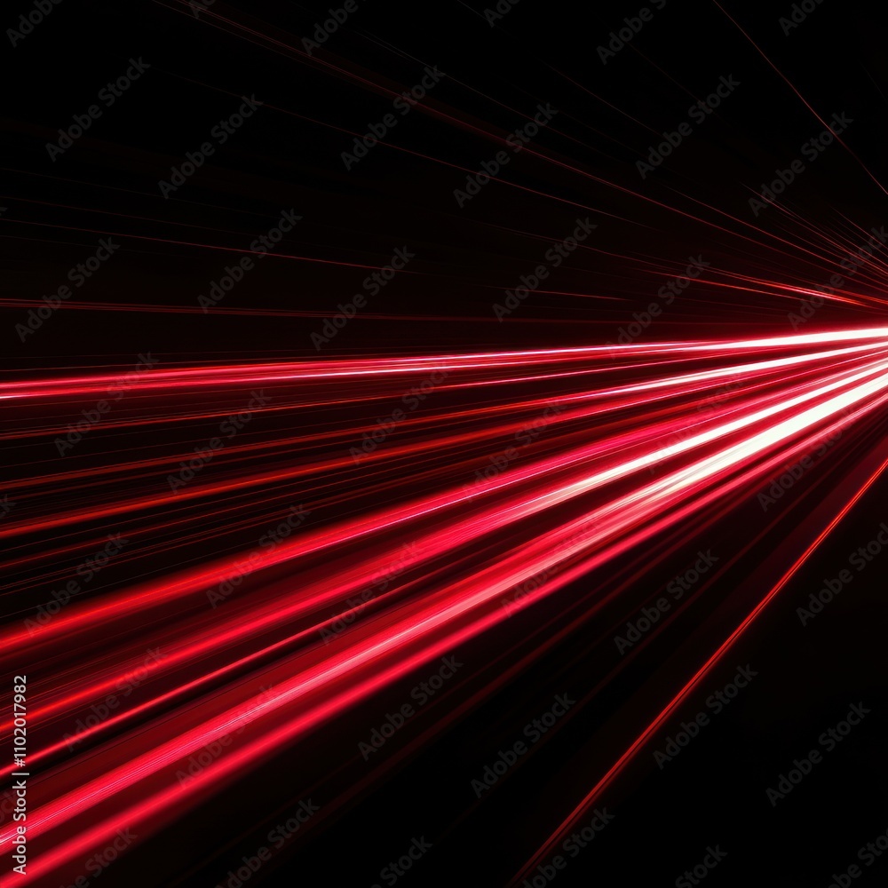 Fototapeta premium A dynamic burst of red light against a dark background.