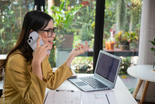 Businesswoman holding a phone talking about a housing development project