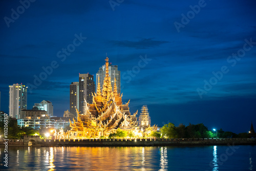 Sanctuary of Truth wooden temple in Pattaya Thailand at night.