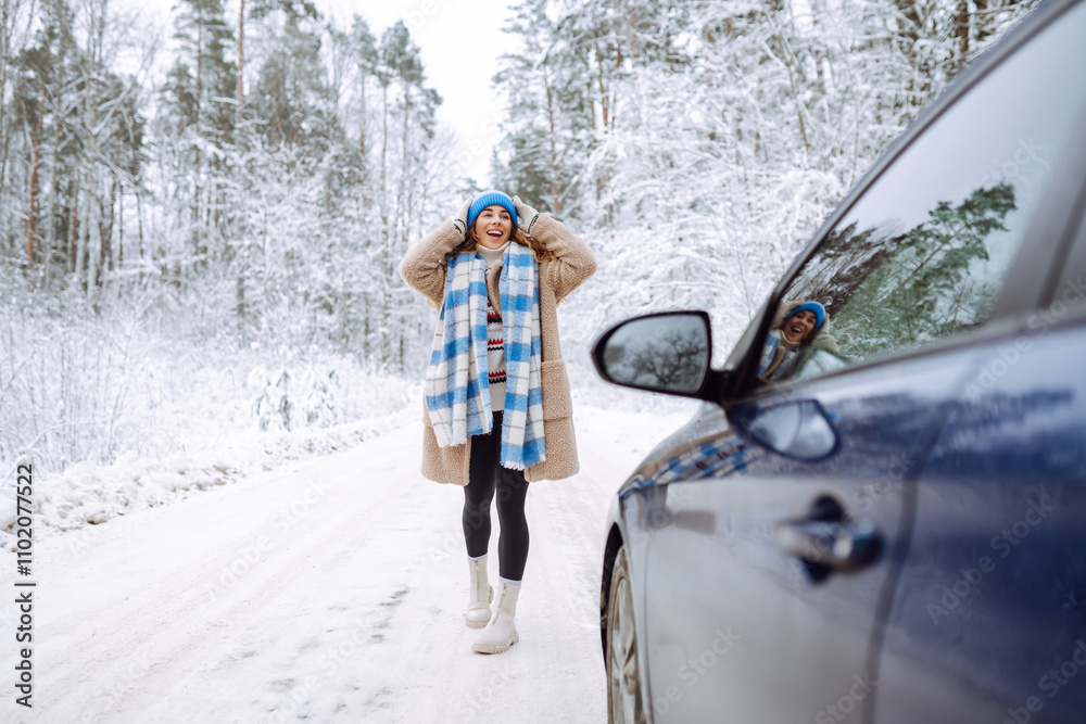 Happy woman near a car in a snowy forest. Winter vacation on the car. Happy woman near a car in a snowy forest. Winter vacation on the car.