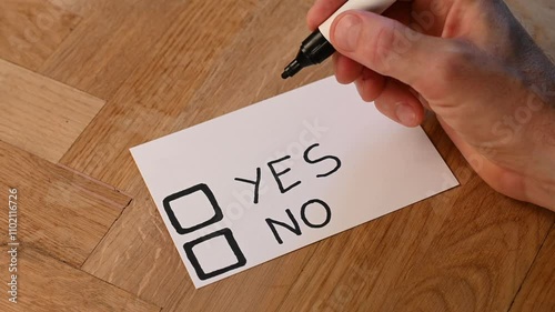 Blank voting card shows person casting yes vote. Public opinion supports an idea or notion. Standing in favour of the ballot subject under review