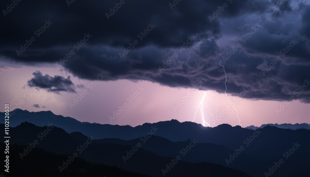 Dramatic lightning strike over silhouetted mountain range at night. Dramatic lightning strike over silhouetted mountain range at night.