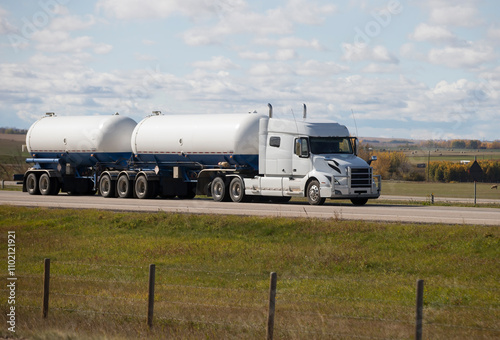 Heavy Cargo on the Road. A truck hauling freight along a highway. Taken in Alberta, Canada