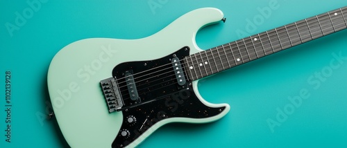 Serene Seafoam Green Electric Guitar on Teal Background - Minimalistic Music Inspiration