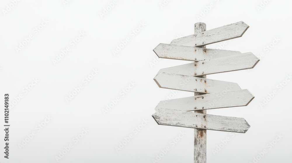 Obraz premium Minimalist white signpost with multiple empty signs against foggy background