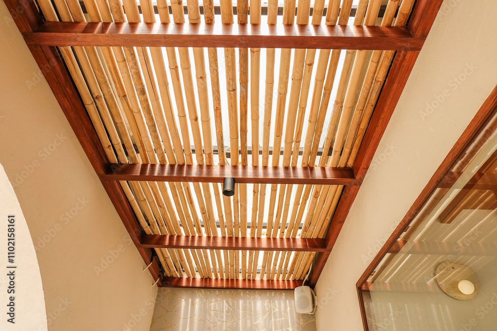 Obraz premium Bamboo pattern to prevent sun for Mediterranean shade,Bamboo mats on a roof,The walls are made of bamboo with sunlight,front view,copy space.