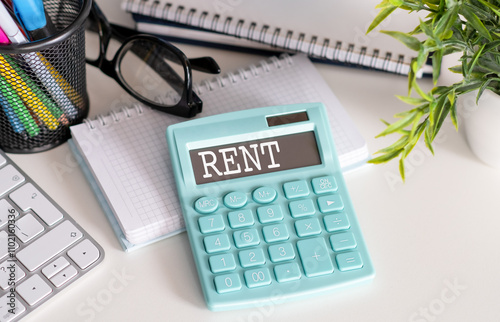 Calculator with the word RENT on the display, business concept. photo