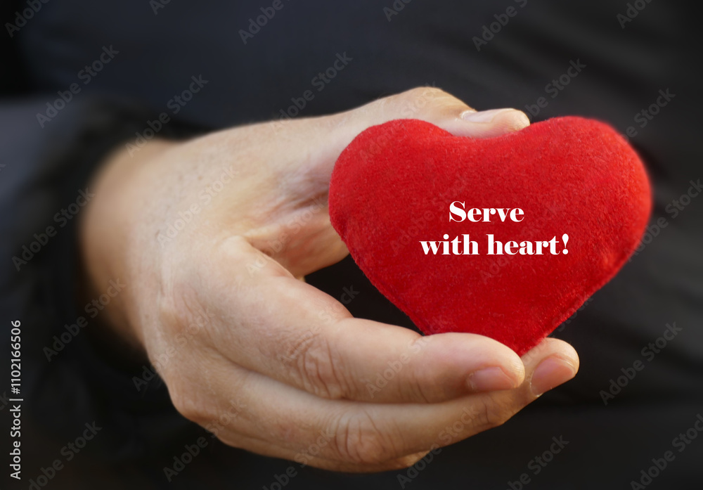 Serve with heart - man hold in hand a red heart with letters Serve with heart - man hold in hand a red heart with letters
