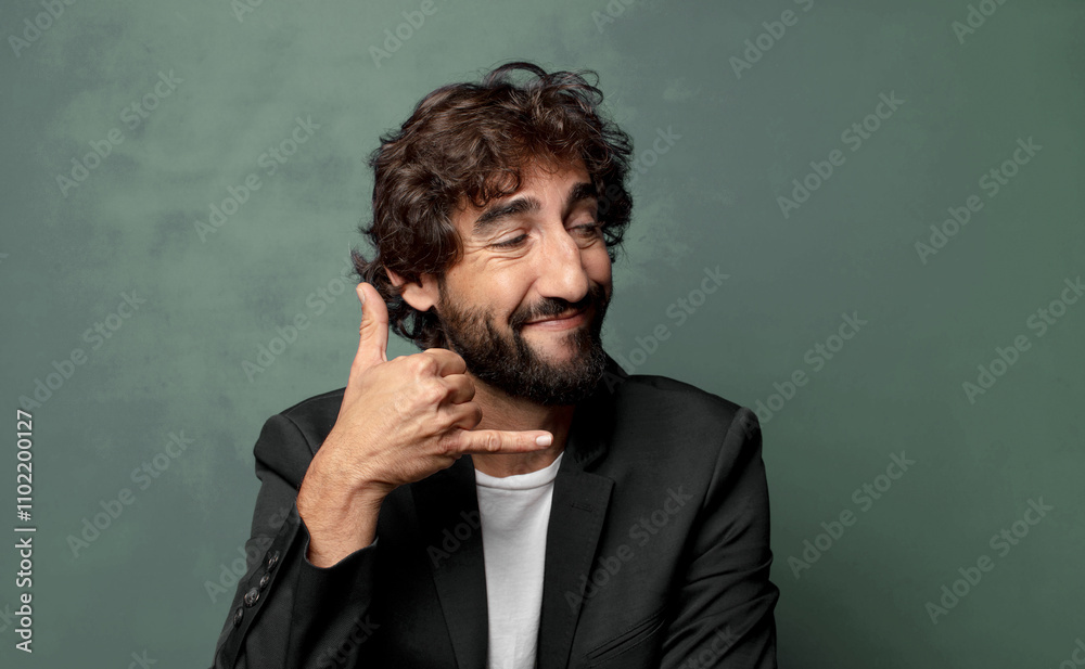 smiling cheerfully and pointing to camera while making a call you later gesture, talking on phone smiling cheerfully and pointing to camera while making a call you later gesture, talking on phone