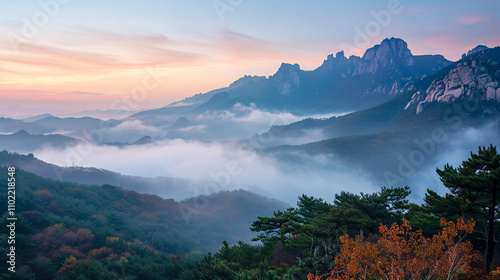 Bukhansan Mountains covered by morning fog at sunrise in Bukhansan National Park, Seoul, South Korea. photo