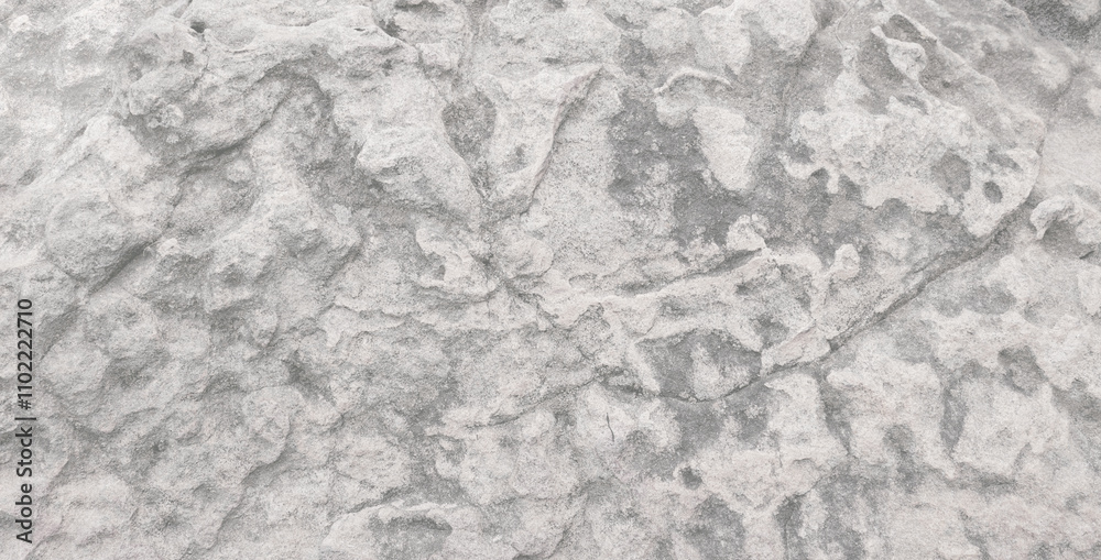 Naklejka premium Empty grey grain stone wall on cave for abstract background and texture. beautiful patterns, space for work, banner,seamless wallpaper, close up.