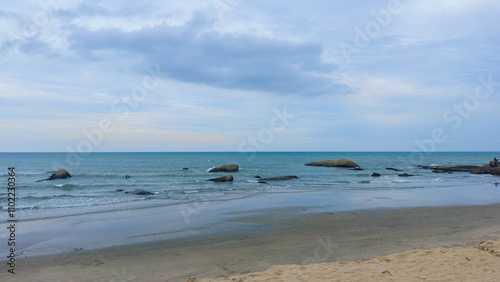 Rocky Stones Scattered Across Vast Sea by Beach Shore