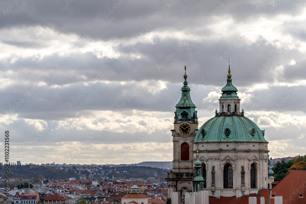 Prague's historical architecture, with the St Nicholas' baroque church towers and dome at Mala strana, offering a glimpse into the city's past. Prague's historical architecture, with the St Nicholas' baroque church towers and dome at Mala strana, offering a glimpse into the city's past.