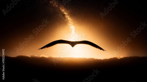  a seagull soaring through the sky at sunset, its wings spread wide as it soars through the air The sky is a beautiful mix of oranges, pinks, and purples, and the s photo