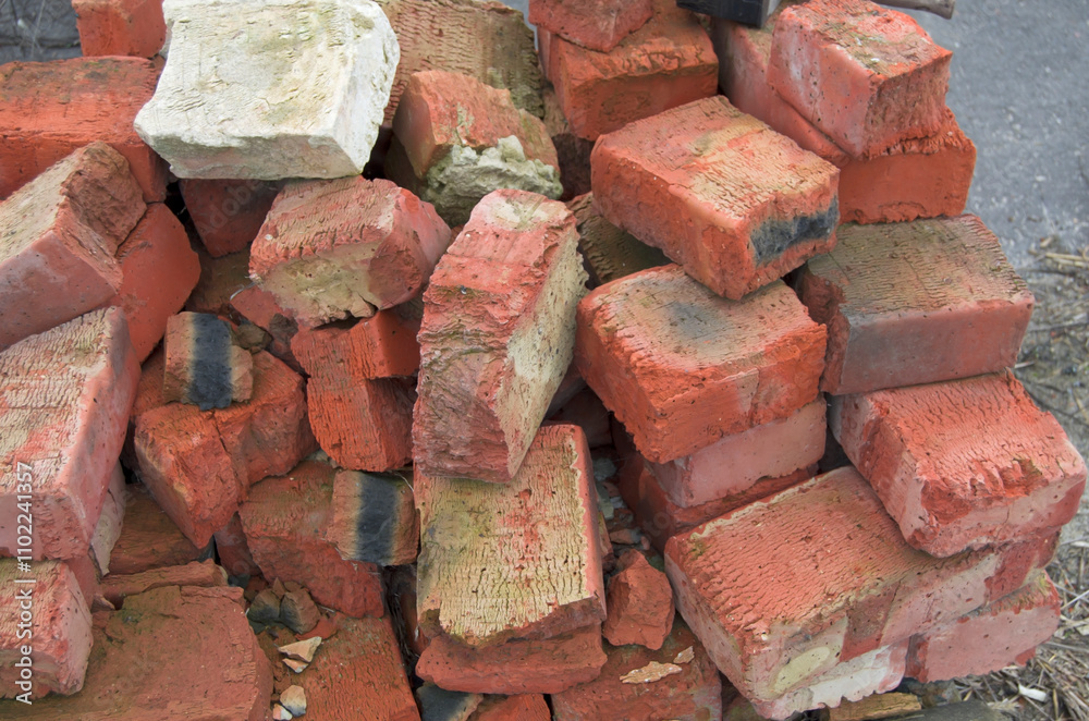 Stacks of old red brick pavers.Recycled building materials. Stacks of old red brick pavers.Recycled building materials.