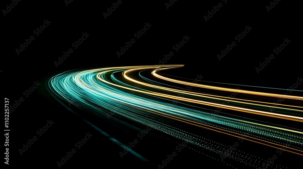 Fototapeta premium Dynamic blue and yellow light trails create a mesmerizing abstract pattern in a dark environment
