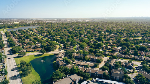 Apartment complex, residential neighborhood in lakeside community in Coppell suburbs Dallas, Texas, tree lined residential street, row of single-family houses, fast growing housing market, aerial photo
