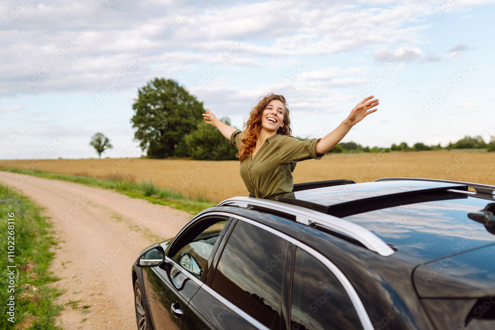 Happy woman on road, enjoying window view and traveling on holiday road trip. Travel, adventure drive. Happy woman on road, enjoying window view and traveling on holiday road trip. Travel, adventure drive.