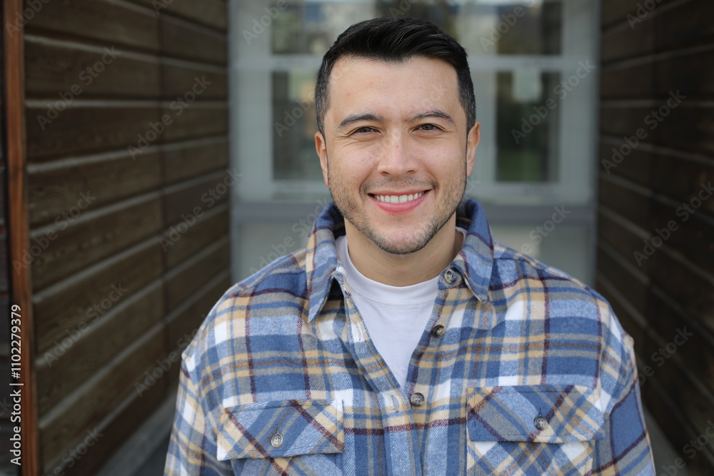 Obraz premium Handsome ethnic man wearing a plaid shirt 