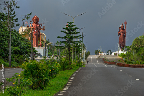 Huge bronze statues of Hindu divinities at the entrance of the road to the scared lake of Grand Bassin in Mauritius