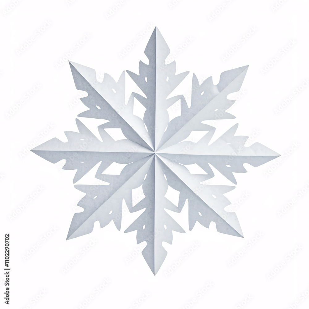A delicate paper snowflake, hanging against a white background