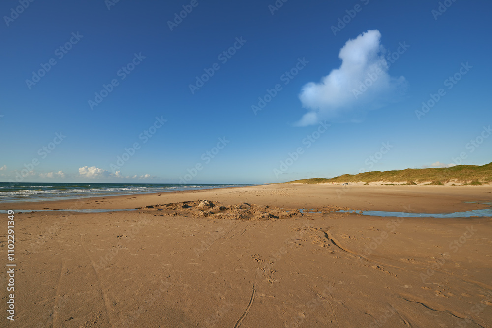 Ocean, beach and blue sky for travel, holiday destination and location for summer vacation trip. Sea water, sand and landscape for tourism, adventure and waves in horizon with mockup space in Bali Ocean, beach and blue sky for travel, holiday destination and location for summer vacation trip. Sea water, sand and landscape for tourism, adventure and waves in horizon with mockup space in Bali