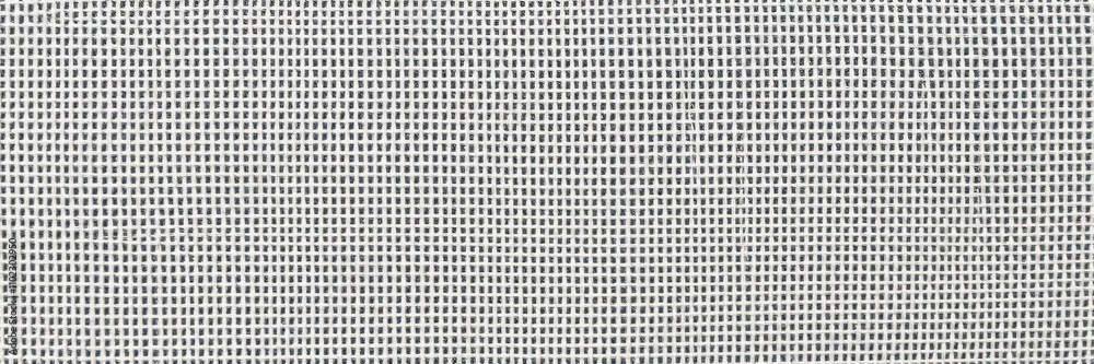 Close-up shot of a textured canvas surface resembling woven fabric, art supply, natural Close-up shot of a textured canvas surface resembling woven fabric, art supply, natural