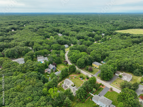 Aerial view of Suburban neighborhood in Sharon, Norfolk County, Massachusetts, with green forest and big villa.