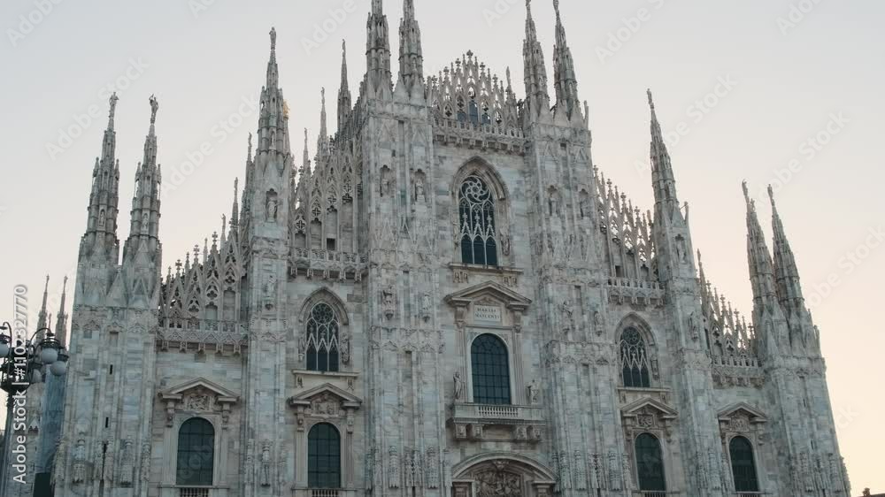 Milan Cathedral on Cathedral square in the morning, Milan, Lombardia, Italy. Piazza del Duomo with Duomo di Milano with intricate Gothic architecture Milan Cathedral on Cathedral square in the morning, Milan, Lombardia, Italy. Piazza del Duomo with Duomo di Milano with intricate Gothic architecture