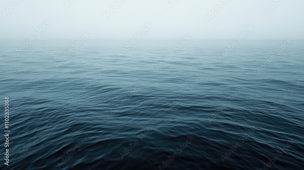Obraz premium Calm, misty ocean surface.